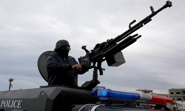 A member of the central security support force holds a weapon during the security deployment in the Tajura neighborhood, east of Tripoli, Libya December 30, 2019. REUTERS/Ismail Zitouny
