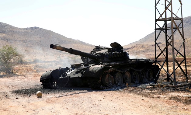FILE PHOTO: A destroyed and burnt tank that belonged to the eastern forces led by Khalifa Haftar, is seen in Gharyan south of Tripoli Libya June 27, 2019. REUTERS/Ismail Zitouny/File Photo
