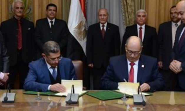 Military Production Minister Mohamed Saeid el Assar witnessed the signing of a protocol of cooperation between the Egyptian Academy for Engineering and Advanced Technology (EAE&AT) and Zewail City of Science and Technology - Press Photo