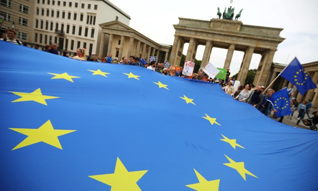 FILE PHOTO: Demonstrators hold an EU flag during a rally under the slogan "Stop the Coup" to protest against attempts to force through a no-deal Brexit, in Berlin, Germany September 7, 2019. REUTERS/Hannibal Hanschke/File Photo