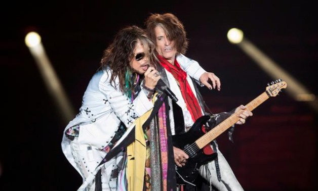 FILE PHOTO: Vocalist Steven Tyler (L) and guitarist Joe Perry of Aerosmith perform during their "Aerosmith: Let Rock Rule" tour at The Forum in Inglewood, California July 30, 2014. REUTERS/Mario Anzuoni/File Photo