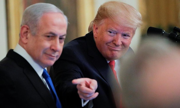 U.S. President Donald Trump points past Israel's Prime Minister Benjamin Netanyahu as they discuss a Middle East peace plan proposal during a joint news conference in the East Room of the White House in Washington, U.S., January 28, 2020. REUTERS/Brendan 