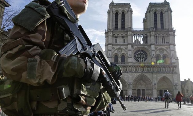 An armed French soldier patrols in front of Notre Dame Cathedral in Paris, France, December 24, 2015 -
 REUTERS

