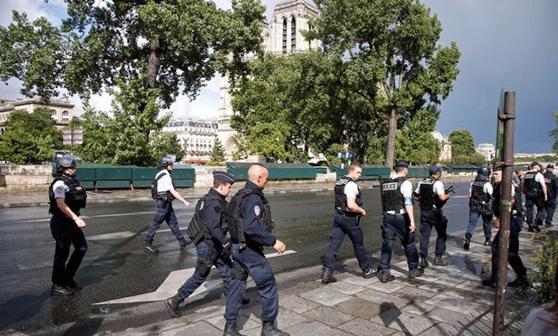 French police stand at the scene of a shooting incident near the Notre Dame Cathedral in Paris, France, June 6, 2017. REUTERS/Charles Platiau