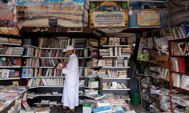 A man reads a book at a bookshop in Bab Doukkala in the city of Marrakech, Morocco May 13, 2017. REUTERS/Youssef Boudlal