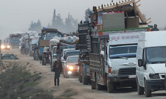 A view of trucks carrying belongings of displaced Syrians, is pictured in the town of Sarmada in Idlib province, Syria, January 28, 2020. REUTERS/Khalil Ashawi