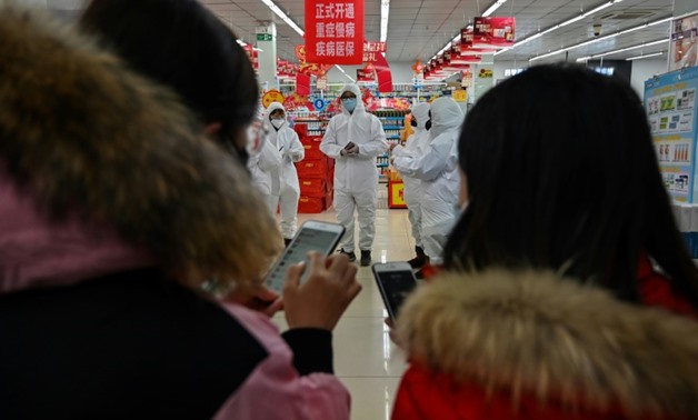 As of Saturday, almost 1,300 people have been infected across China, the bulk of them in and around Wuhan - AFP
