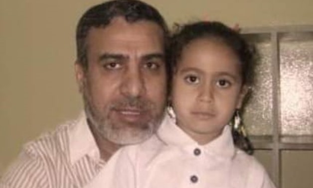 FILE - Engineer Ali Salem along with his daughter 