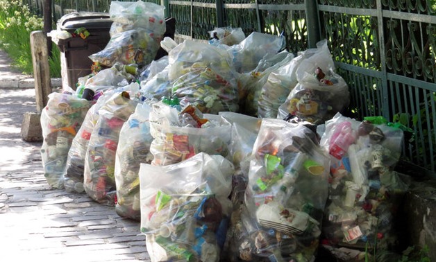 FILE - plastic bags filled with trash - Torange