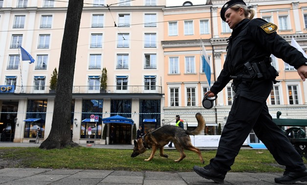 A police officer with a dog secures a street outside the venue of the annual Munich Security Conference in Munich, Germany February 14, 2020. REUTERS/ Andreas Gebert.