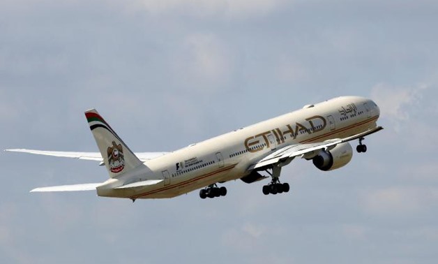 FILE PHOTO - An Etihad Airways Boeing 777-3FX company aircraft takes off at the Charles de Gaulle airport in Roissy, France, August 9, 2016 - REUTERS
