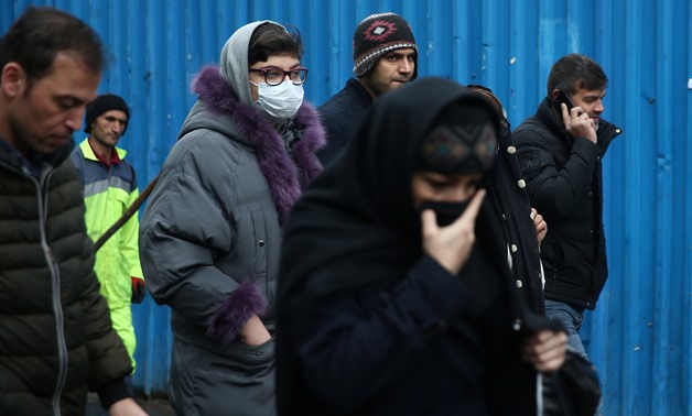 An Iranian woman wears protective mask to prevent contracting a coronavirus, as she walks at Grand Bazaar in Tehran, Iran February 20, 2020. WANA (West Asia News Agency)/Nazanin Tabatabaee via REUTERS