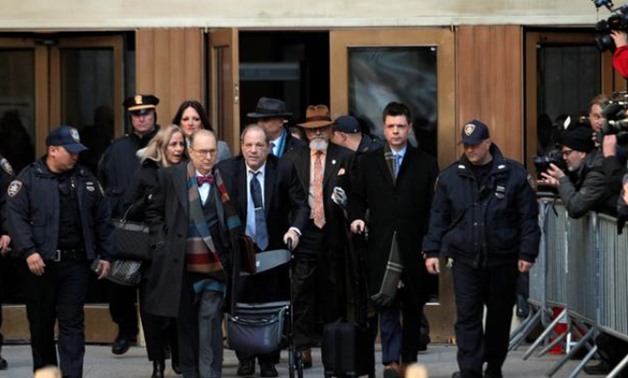 FILE PHOTO: Film producer Harvey Weinstein exits New York Criminal Court following the fourth day of jury deliberations during his sexual assault trial in the Manhattan borough of New York City, New York, U.S., February 21, 2020. REUTERS/Andrew Kelly