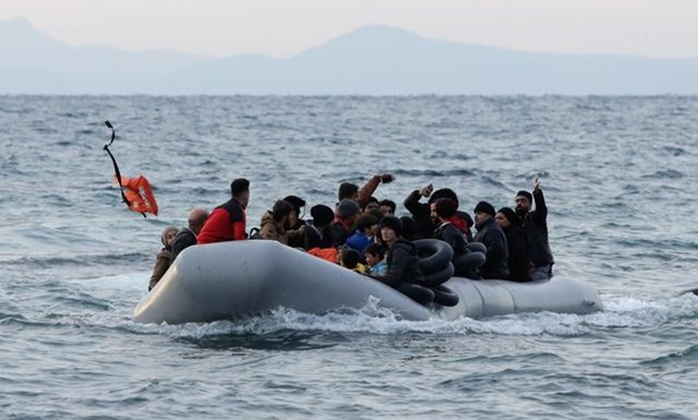 Migrants from Syria, Iraq, Afghanistan and Palestinian territories arrive on a dinghy near the city of Mytilene, after crossing part of the Aegean Sea from Turkey to the island of Lesbos, Greece, March 1, 2020. REUTERS/Elias Marcou
