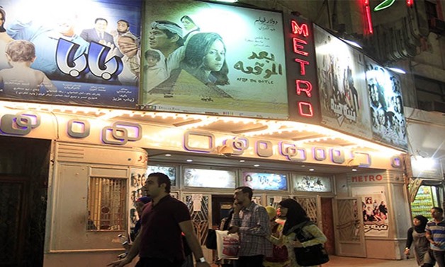People walk past a cinema in Cairo, Oct. 16, 2012. REUTERS/Mohamed Abd El Ghany