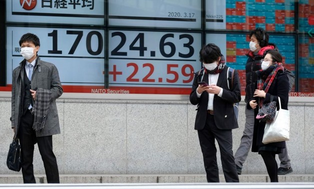 Tokyo stocks opened higher on Wednesday, extending rallies on Wall Street as the US and European governments signalled more stimulus measures to address the economic hit from the coronavirus. PHOTO: AFP
