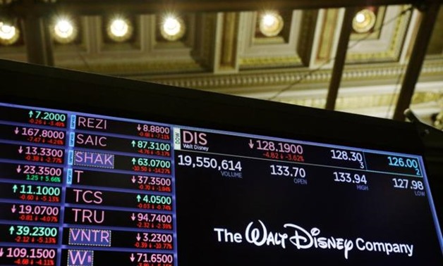 FILE PHOTO: The logo of the Walt Disney Company is displayed above the floor of the New York Stock Exchange shortly after the closing bell as the market takes a significant dip in New York, U.S., February 25, 2020. REUTERS/Lucas Jackson.