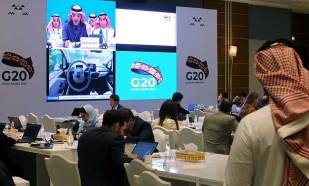 FILE PHOTO: Journalists sit in the media center during the meeting of G20 finance ministers and central bank governors in Riyadh, Saudi Arabia, February 22, 2020./File Photo - REUTERS