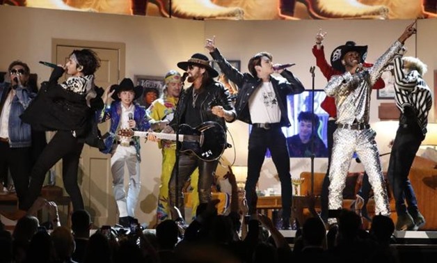 FILE PHOTO: 62nd Grammy Awards - Show - Los Angeles, California, U.S., January 26, 2020 - Lil' Nas X and Billy Rae Cyrus perform with South Korea's BTS. REUTERS/Mario Anzuoni.