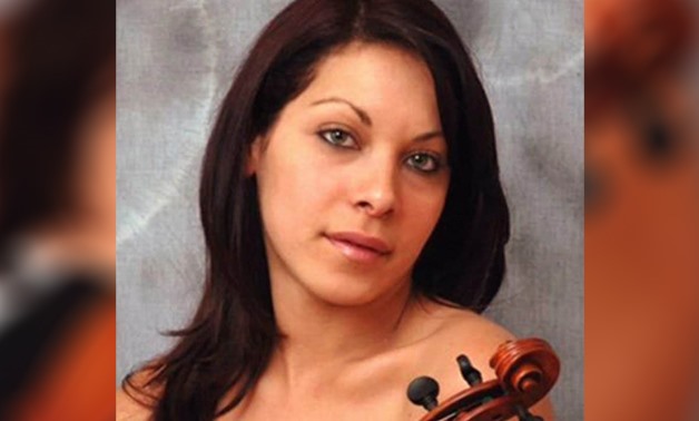 This undated publicity photo provided by her attorney, Philip A. MacNaughton, shows professional violinist Yennifer Correia - AP