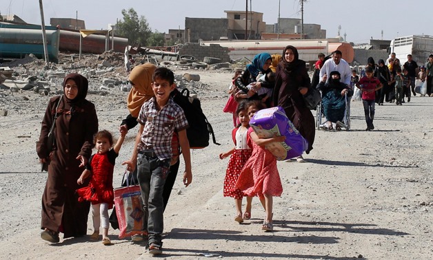 Residents who fled their homes due to fighting between Iraqi forces and Islamic State militants return to their village cleared by the Iraqi forces -  REUTERS/Erik De Castro