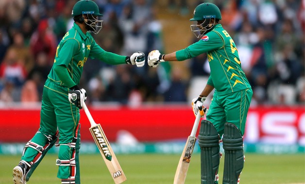 Pakistan's Mohammad Hafeez with Babar Azam after hitting a six - Reuters