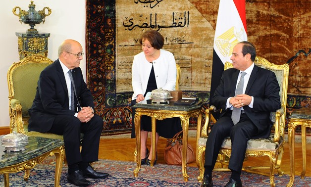 President Abdel Fatah al-Sisi (R) meets with French Foreign Minister Jean-Yves Le Drian (L) – Press photo