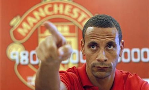 Manchester United defender Rio Ferdinand talks to reporters during a meeting with fans at the English Premier League Asia trophy tour in Jakarta June 30, 2011. REUTERS/Beawiharta