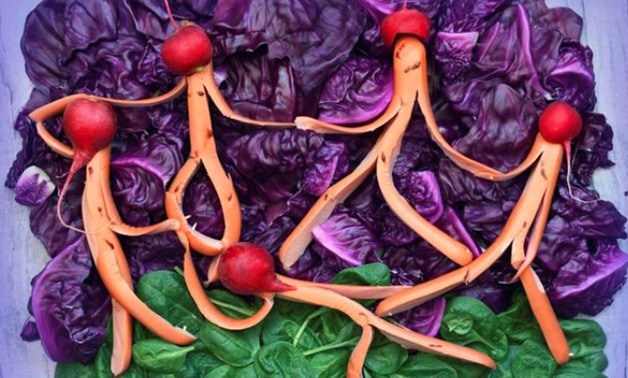 A view shows a replica of "The Dance" painting by French artist Henri Matisse made of sausages, red cabbage, spinach and other food items in Kiev, Ukraine in this undated handout image. Olesia Marchenko/Handout via REUTERS