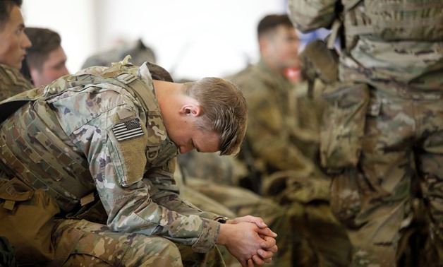 A U.S. Army paratrooper with the 82nd Airborne Division preparing to leave Fort Bragg, N.C., on Wednesday. Reuters