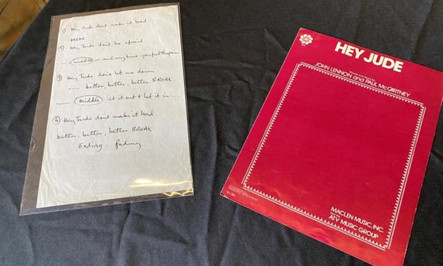 A sheet of paper with partial "Hey Jude" lyrics, written by Paul McCartney for a recording session in 1968, is displayed in a Julien's Auctions warehouse in Torrence, California, U.S. March 5, 2020. REUTERS/Jane Ross.
