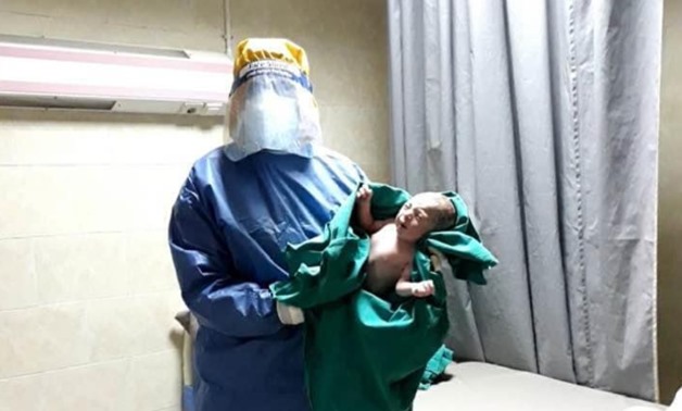 Prime Minister's Media Advisor Hani Younis posted photos for two newborn babies, saying that two women in Egypt infected with the novel coronavirus (COVID-19) gave birth successfully at dawn - Press photo