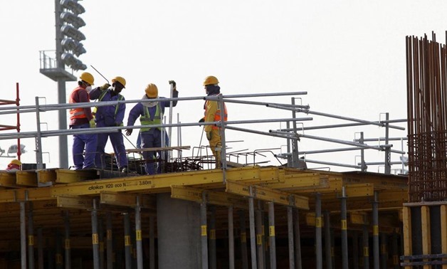 FILE - Foreign workers on the Aspire Zone, a multi-sport venue in Doha - Reuters