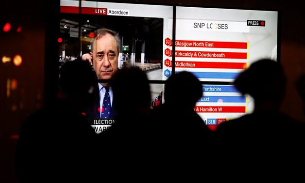Patrons watch the results for Britain's election in London -Reuters 