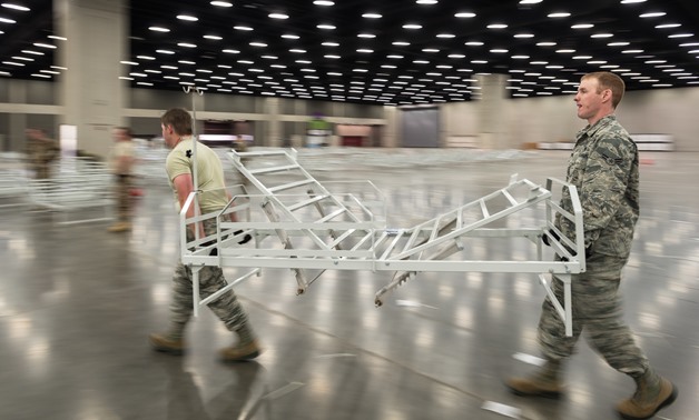 More than 30 members of the Kentucky Air National Guard’s 123rd Civil Engineer Squadron set up hospital beds and clinical space at the Kentucky Fair and Exposition Center in Louisville, Ky., April 11, 2020. The site, which is expected to be operational Ap