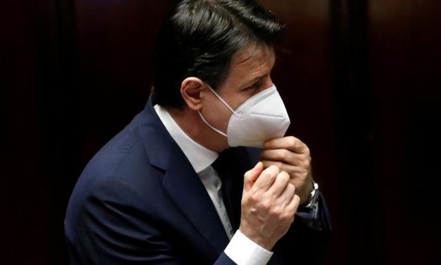 FILE PHOTO: Italian Prime Minister Giuseppe Conte wears a face mask as he attends a session of the lower house of parliament on the coronavirus disease (COVID-19) in Rome, Italy April 21, 2020. REUTERS/Remo Casilli/File Photo