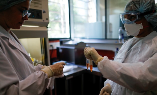 Laboratory technicians get ready during a coronavirus analysis simulation at the Malbran institute in Buenos Aires, Argentina February 29, 2020. Picture taken February 29, 2020. REUTERS/Agustin Marcarian
