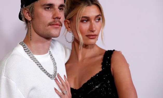 FILE PHOTO: Singer Justin Bieber and his wife Hailey Baldwin pose at the premiere for the documentary television series "Justin Bieber: Seasons" in Los Angeles, California, U.S., January 27, 2020. REUTERS/Mario Anzuoni.