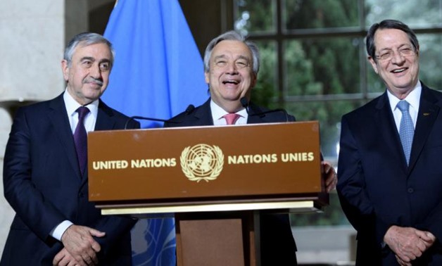 UN Secretary-General Antonio Guterres (C) speaks next to Greek Cypriot President Nicos Anastasiades (R) and Turkish Cypriot leader Mustafa Akinci during a press conference after the Conference on Cyprus, on the sidelines of the Cyprus Peace Talks, at the 
