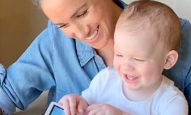 Britain's Meghan Markle, Duchess of Sussex, holds her son Archie, in California, U.S., May 2020, in this screen grab taken from a handout video. SAVE THE CHILDREN/Handout via REUTERS
