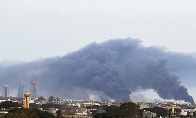 Smoke fumes rise above buildings in the Libyan capital, Tripoli, during shelling on May 9, 2020. (AFP Photo)