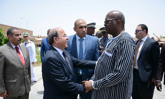 President Roch Marc Christian Kabore of Burkina Faso (R) visits Military Factory 200 - Press photo