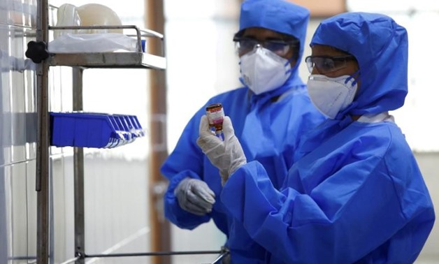 FILE PHOTO: Medical staff with protective clothing are seen inside a ward specialised in receiving any person who may have been infected with coronavirus, at the Rajiv Gandhi Government General hospital in Chennai, India, January 29, 2020. REUTERS/P. Ravi