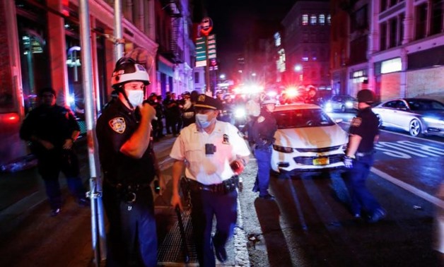 NYPD officers try to take control of the Soho area as they detain protesters who were looting in local stores after marching against the death in Minneapolis police custody of George Floyd, in the Manhattan borough of New York City, U.S., June 2, 2020. RE