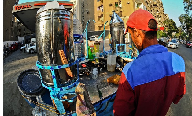 Juice stand selling liquorice, tamarind and Sobia -
 Hussein Talal Photo