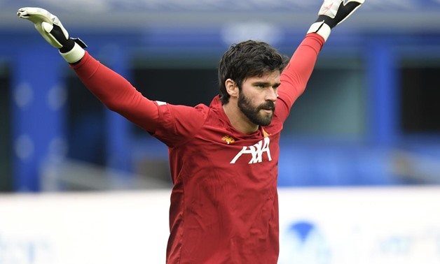 Soccer Football - Premier League - Everton v Liverpool - Goodison Park, Liverpool, Britain - June 21, 2020 Liverpool's Alisson during the warm up before the match, as play resumes behind closed doors following the outbreak of the coronavirus disease (COVI