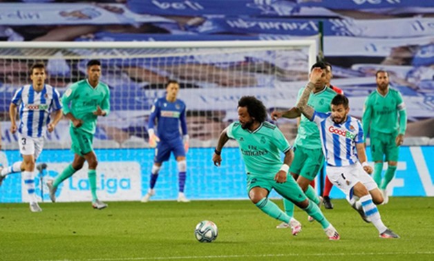 Real Madrid’s Marcelo in action with Real Sociedad’s Portu, as play resumes behind closed doors following the outbreak of the coronavirus disease COVID-19. (Reuters)

