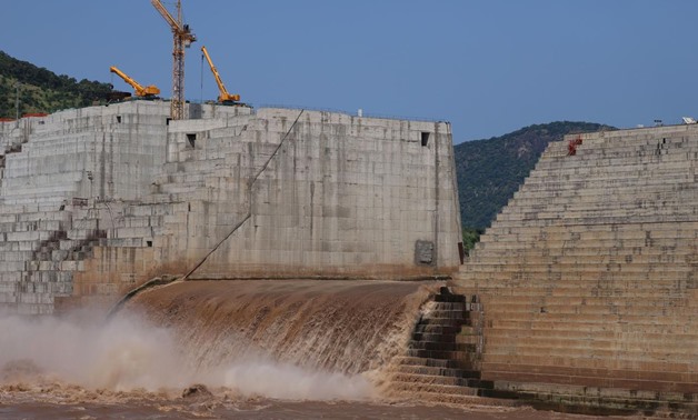 FILE - Water flows through Ethiopia's Grand Renaissance Dam as it undergoes construction work on the river Nile in Guba Woreda, Benishangul Gumuz Region, Ethiopia September 26, 2019. REUTERS/Tiksa Negeri