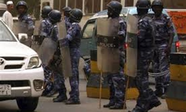 A line of police personnel holding batons and shields in Khartoum June 11, 2011. REUTERS/Stringer
