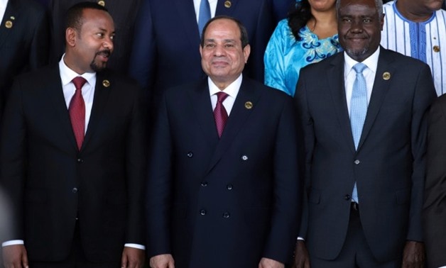 From left, Ethiopia’s Prime Minister Abiy Ahmed, Egyptian President Abdel Fattah El Sisi and African Union Commission Chairperson Moussa Faki Mahamat at the opening of the 33rd Ordinary Session of the Assembly of the Heads of State and the Government of t